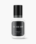 bottle of purify lash adhesive